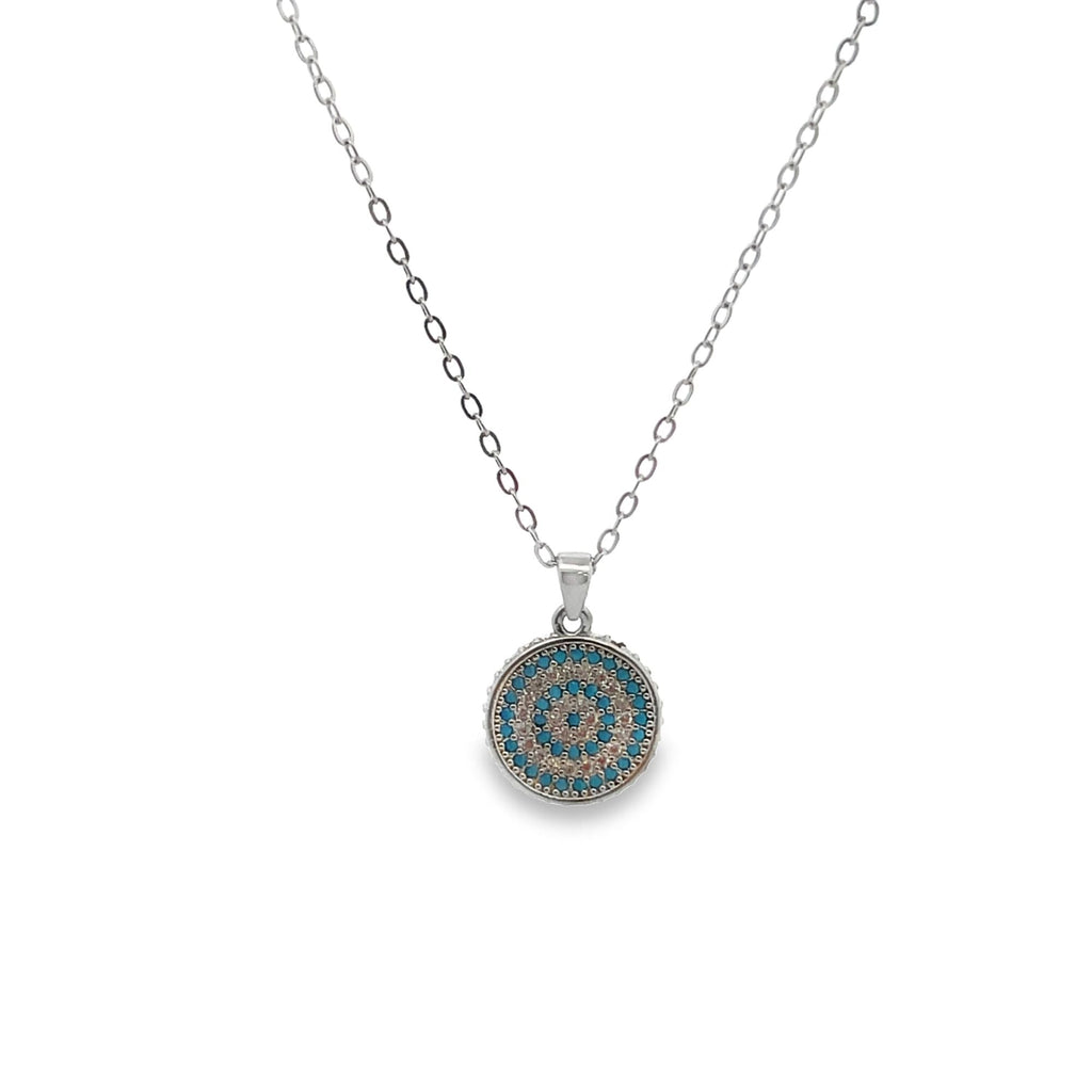 Close-up of blue CZ stones on Coin Medallion Necklace by MIA Jewelry