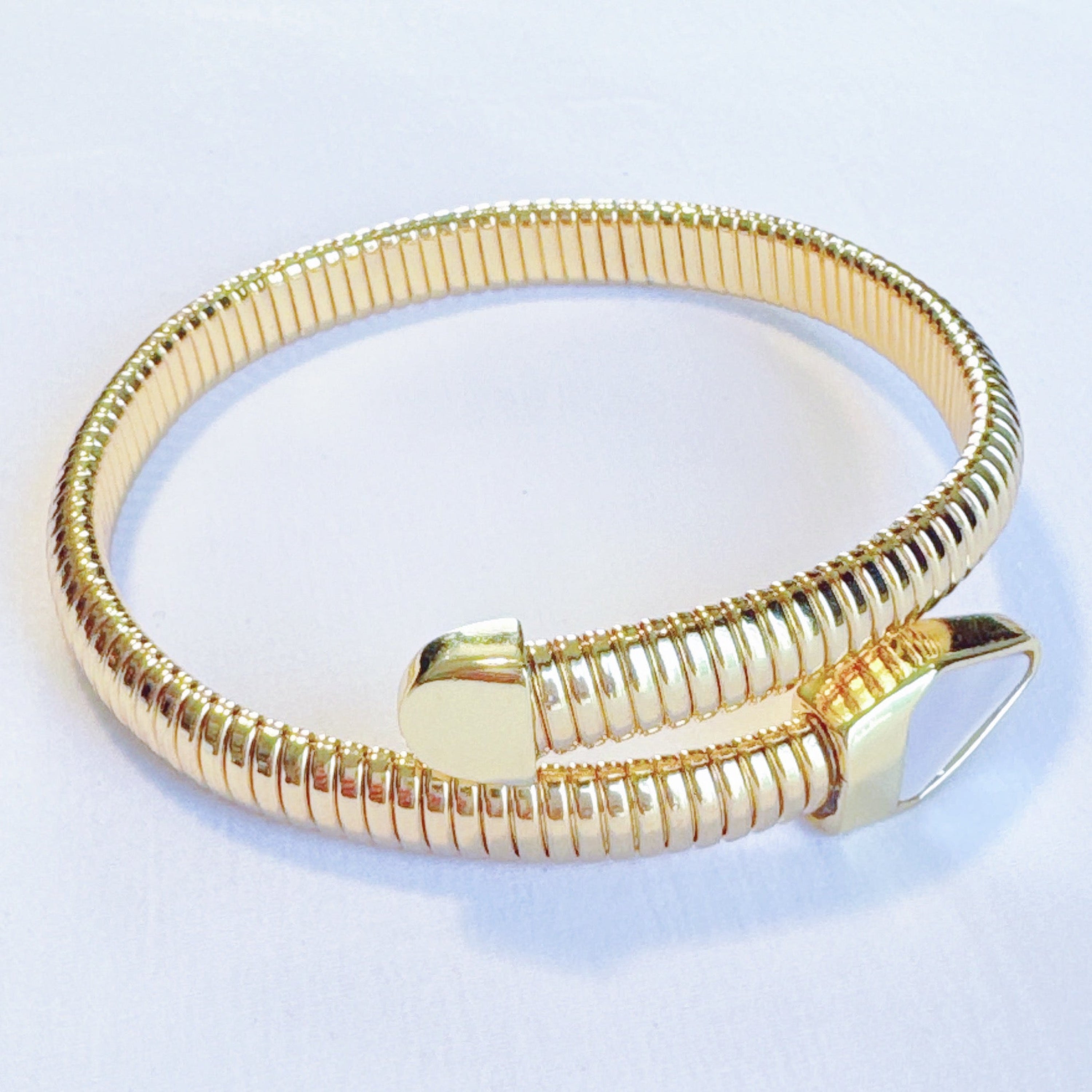 Side view showcasing the unique design of Viper Golden Coil Bangle Bracelet
