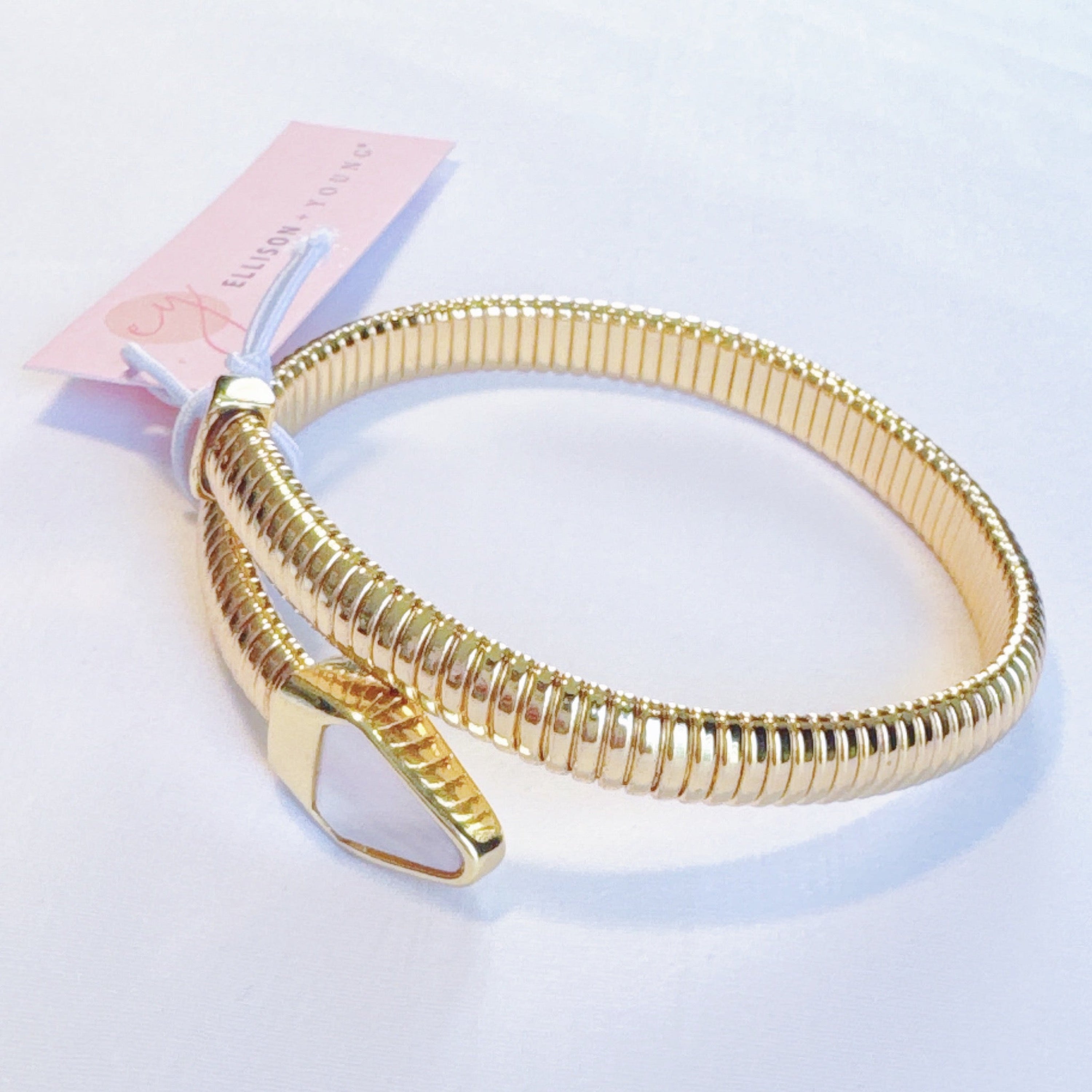 Close-up of the intricate details on Viper Golden Coil Bangle Bracelet