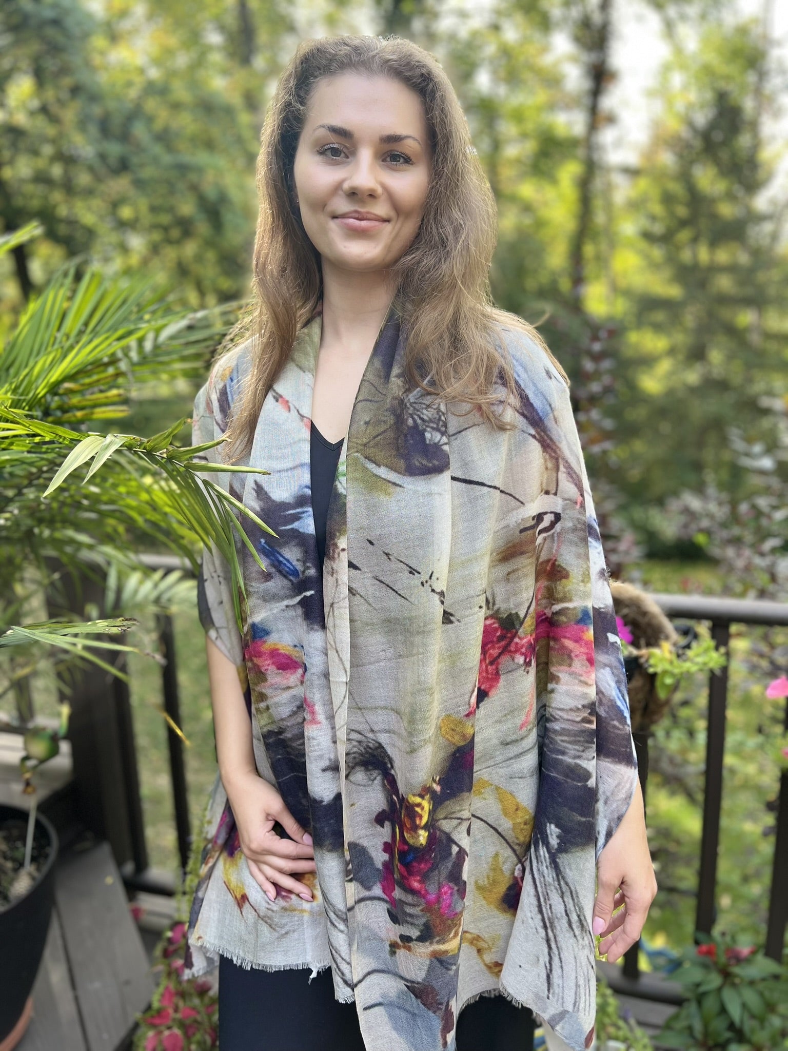 Gray and White Abstract Wool Scarf displayed on a wooden table