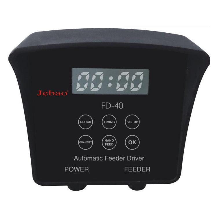 Smart Automatic Pond Fish Feeder display in a beautiful garden pond