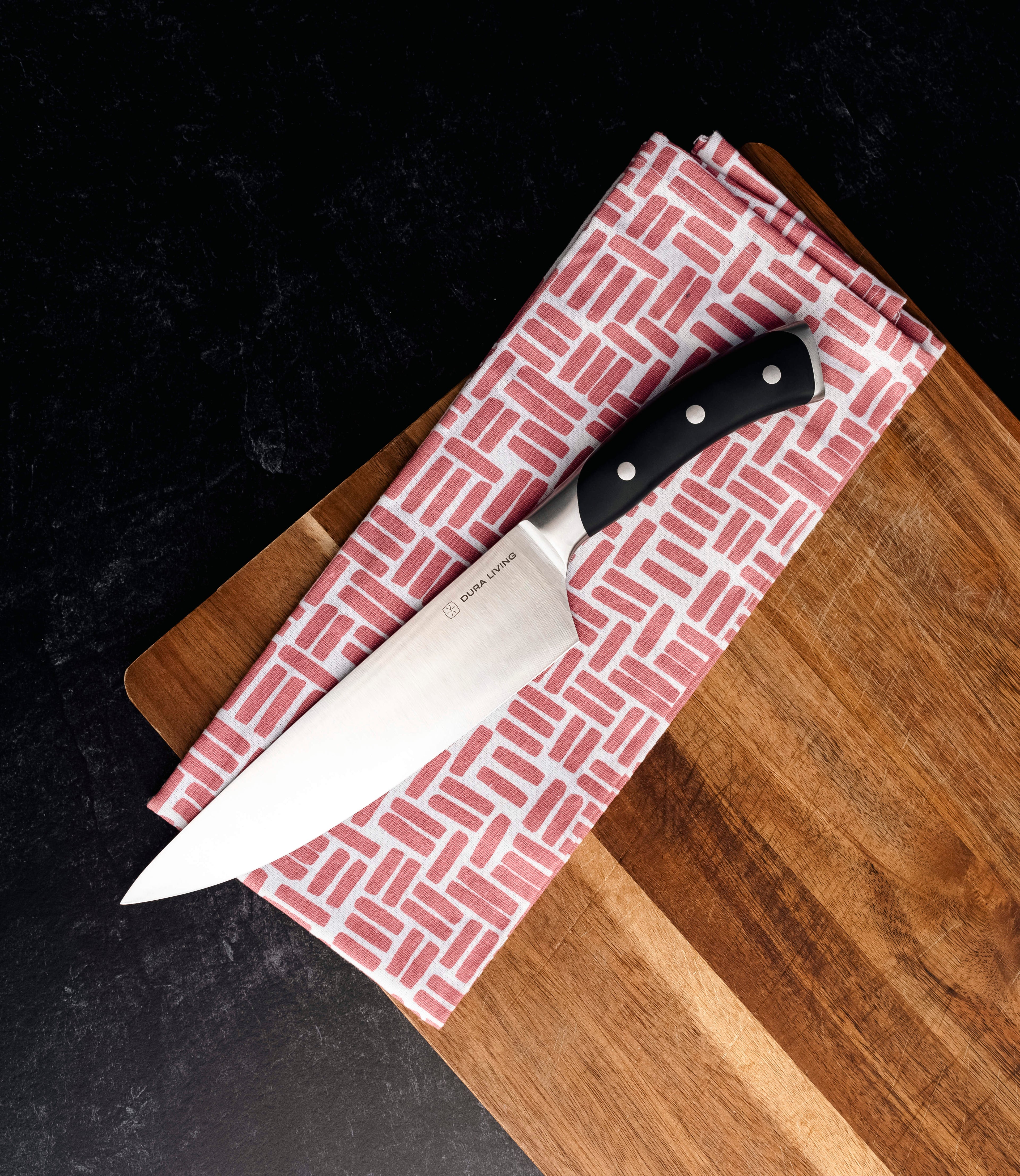 Dura Living paring knife on cutting board with fresh vegetables