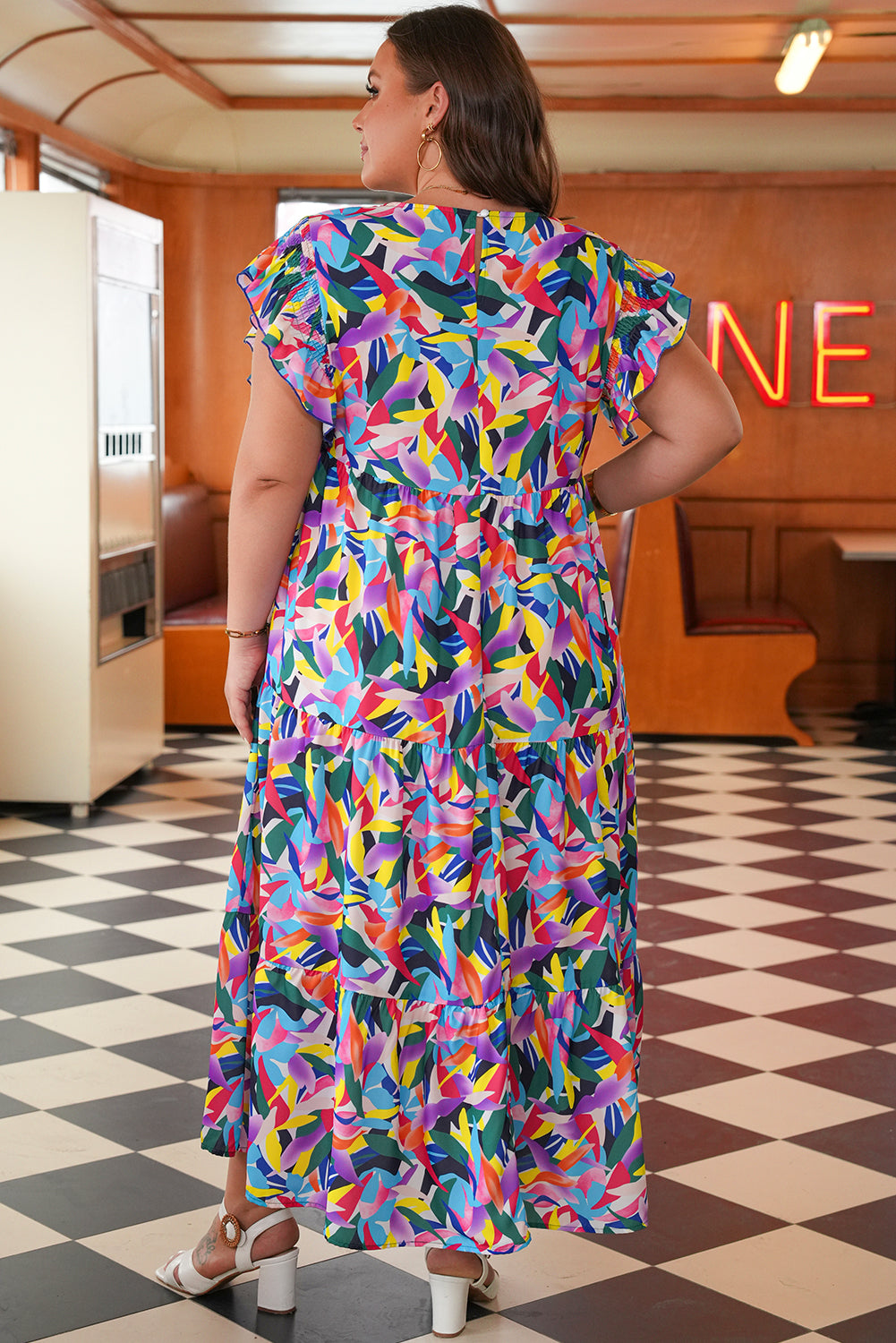 Side view of Noa Plus Size Ruffled Maxi Dress showcasing ruffled sleeves