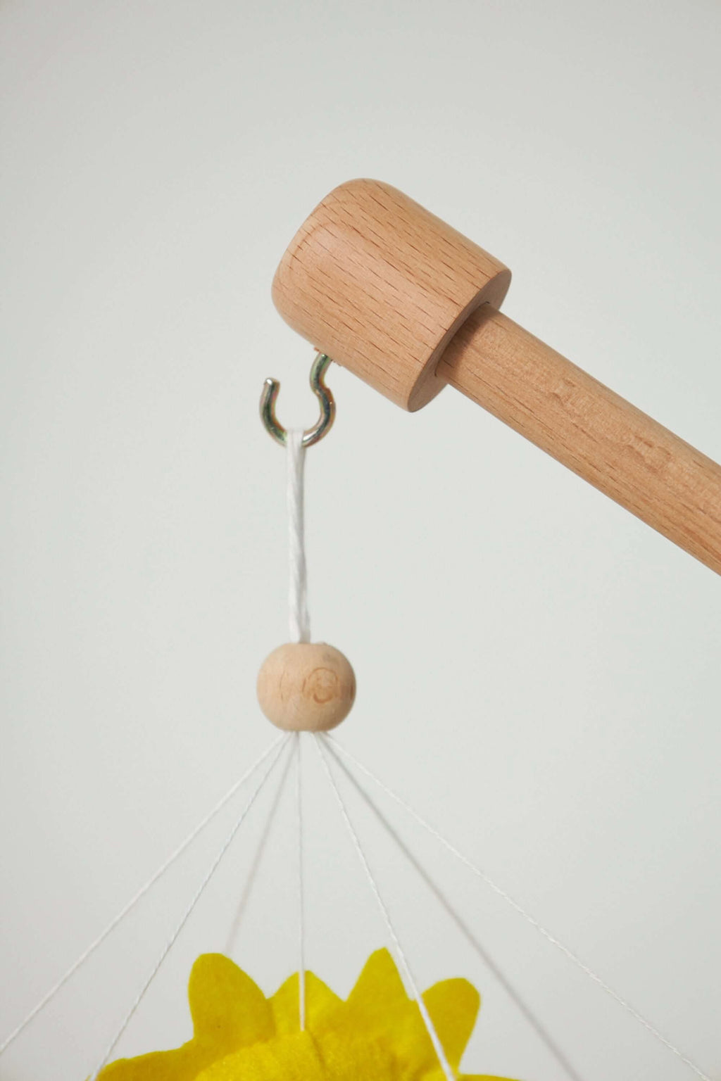 Detailed shot of felt birds on Handcrafted Montessori Baby Mobile