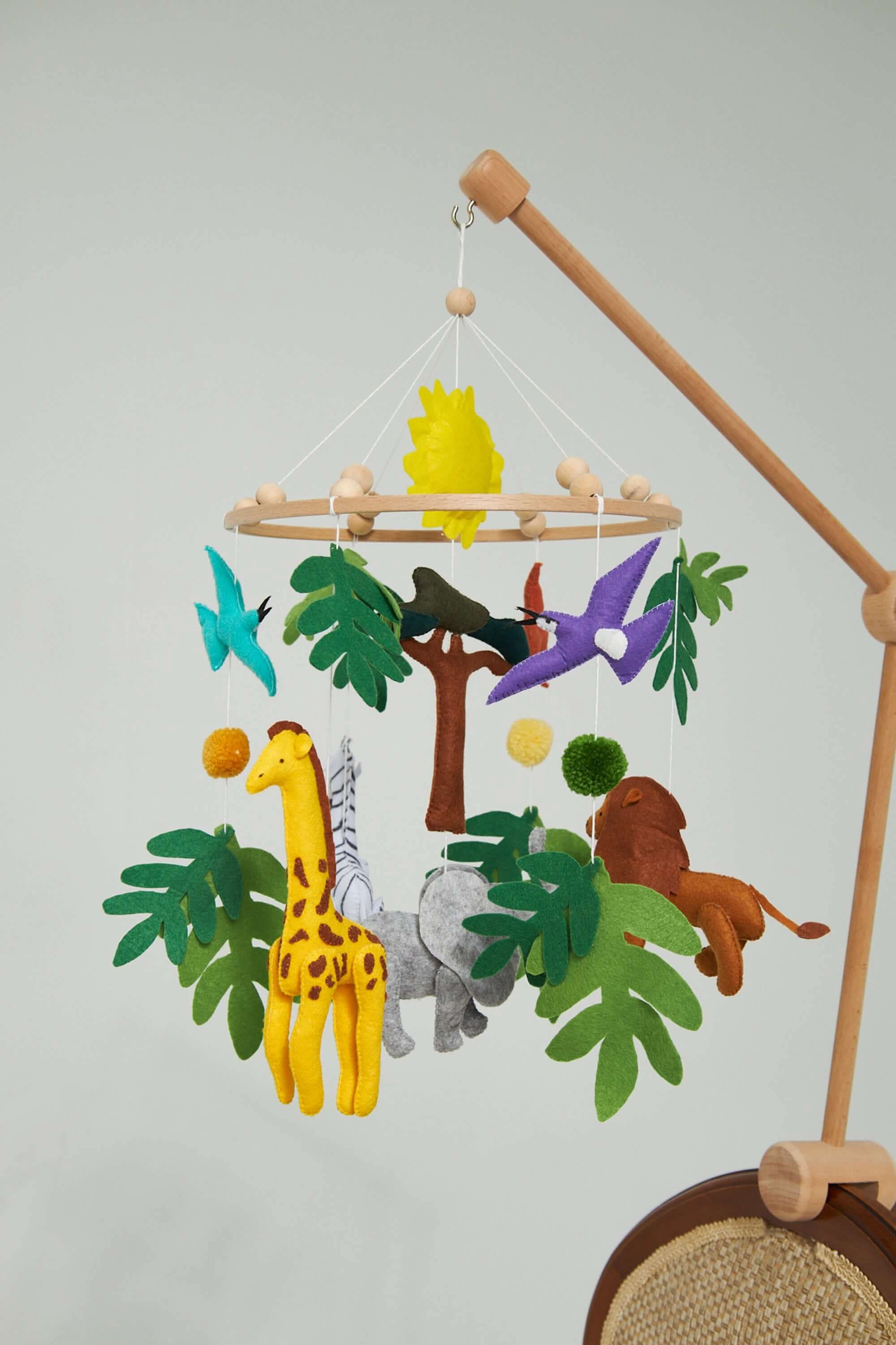 Front view of Handcrafted Montessori Baby Mobile in soft colors by Kidodido