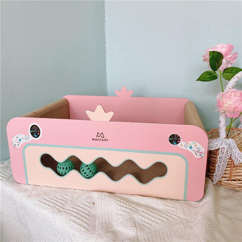 Side view of the Crown Cat Scratch Board with integrated ball feature