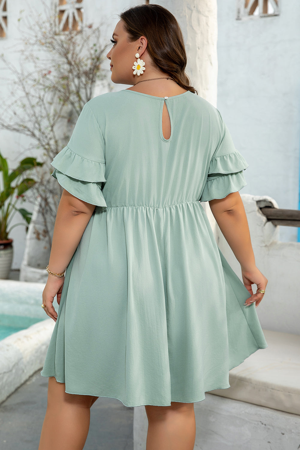 Side view of Gracie Plus Size Ruffle Mini Dress showcasing ruffle details