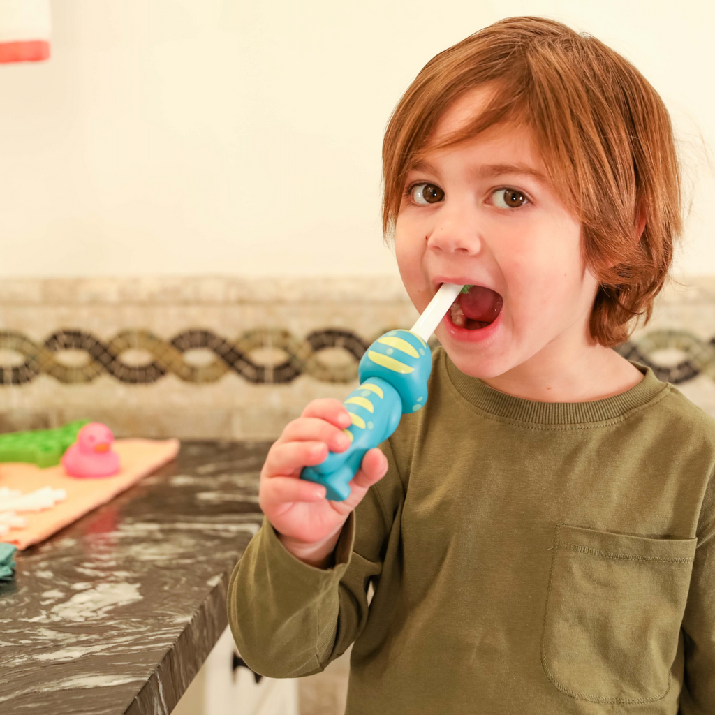 Back of Brushy the Brushasaurus Dinosaur Toothbrush showcasing grip handle
