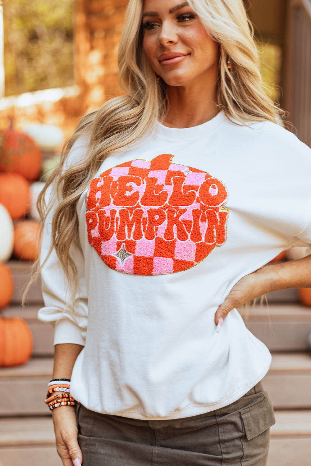 Model wearing Blair Pumpkin Pullover Sweatshirt for a casual fall look