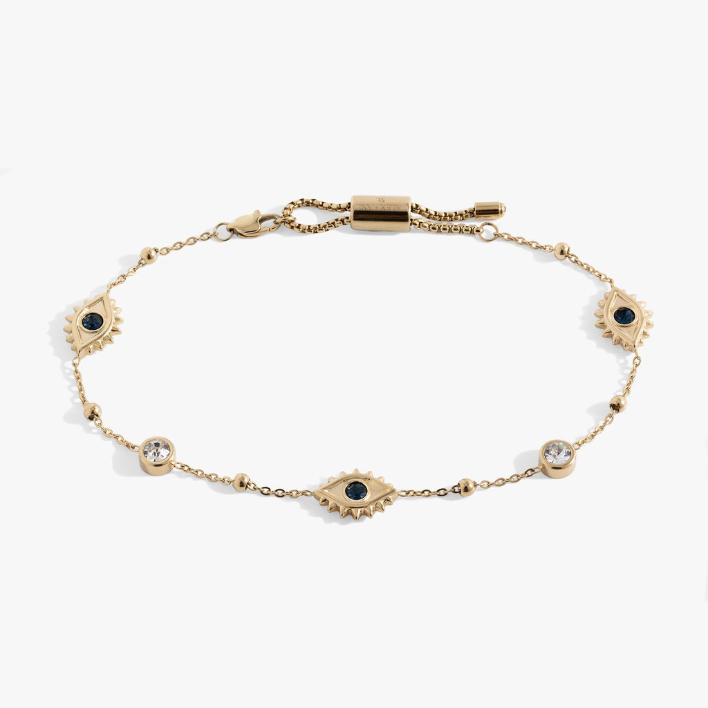 Evil Eye Crystal Anklet showcasing sparkling clear crystals on a beach