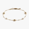 Evil Eye Crystal Anklet showcasing sparkling clear crystals on a beach
