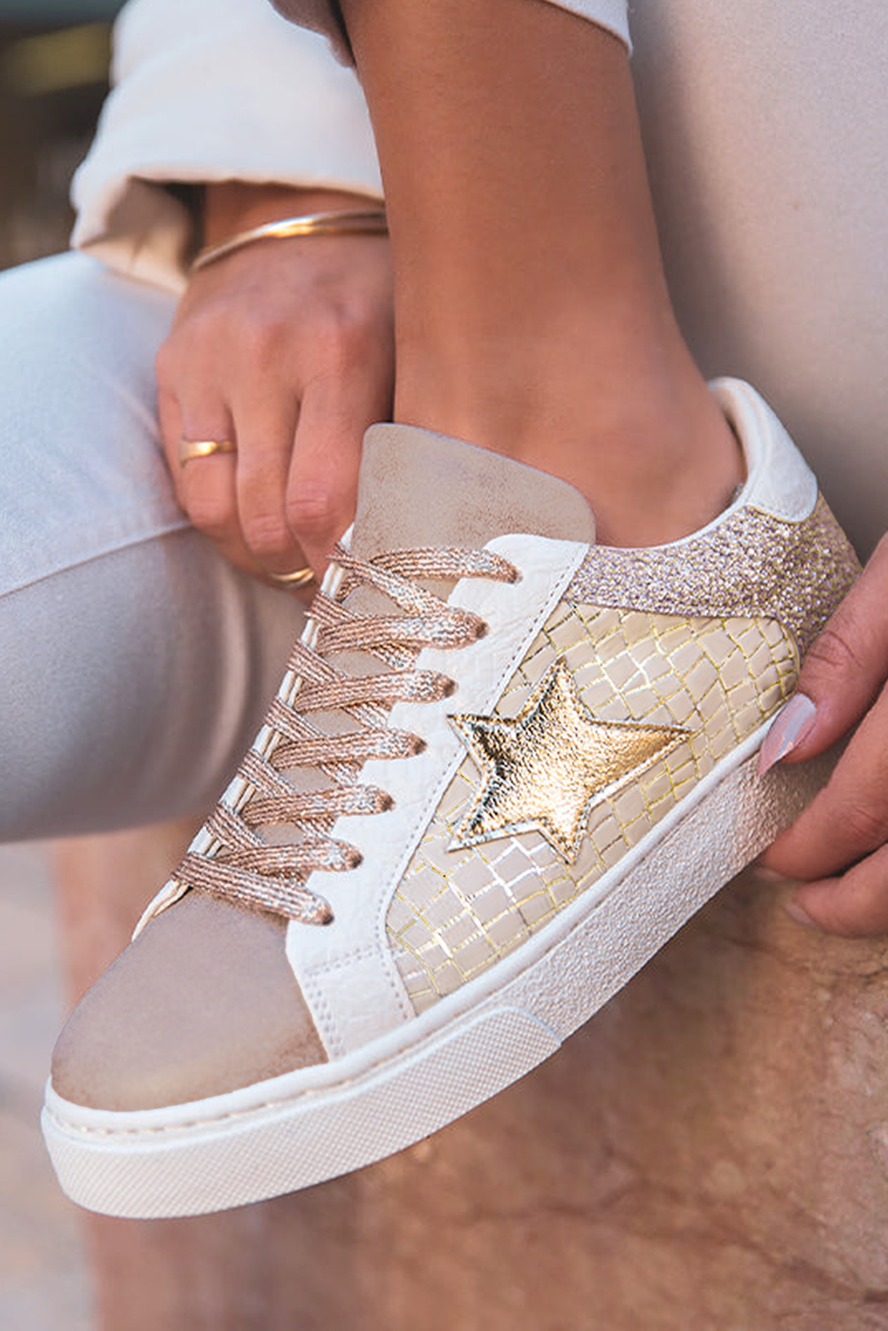 Side view of Shimmering Gold Star Lace-Up Sneakers by Threaded Pear