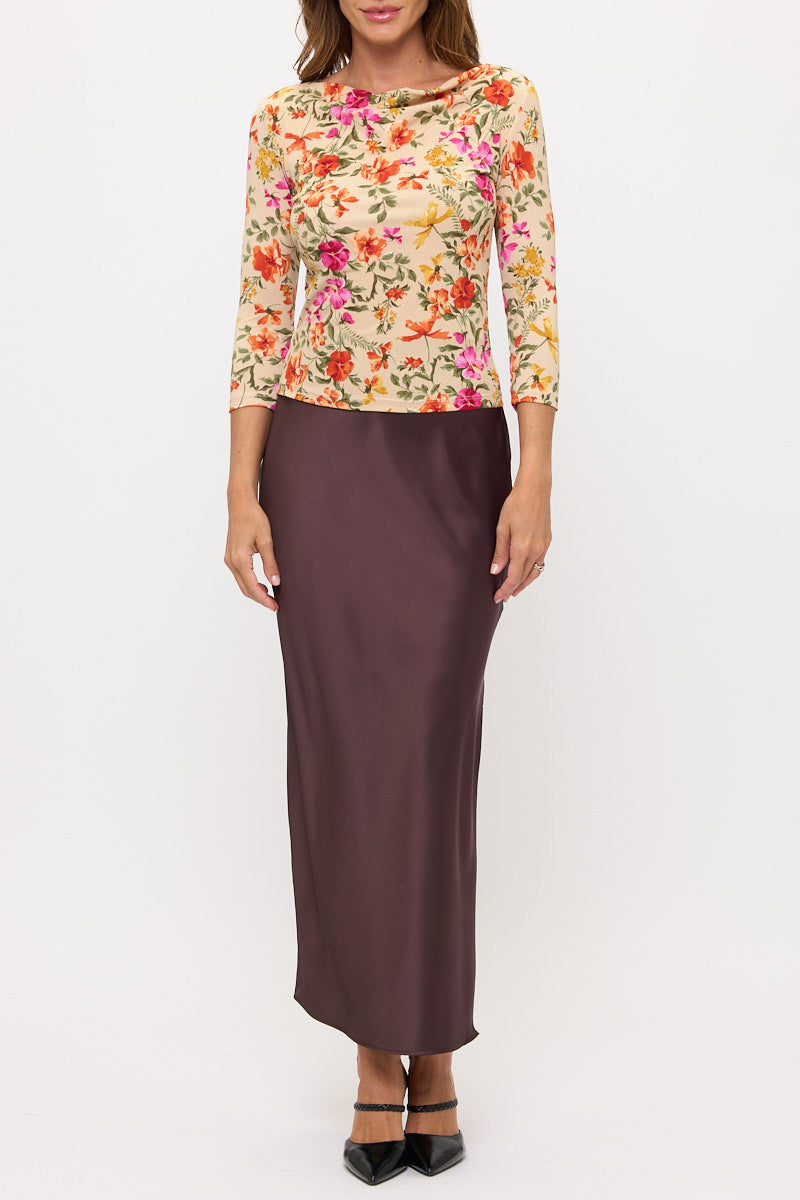 Side view showcasing 3/4 sleeves of Elegant Floral Boat Neck Top by Reneecollection