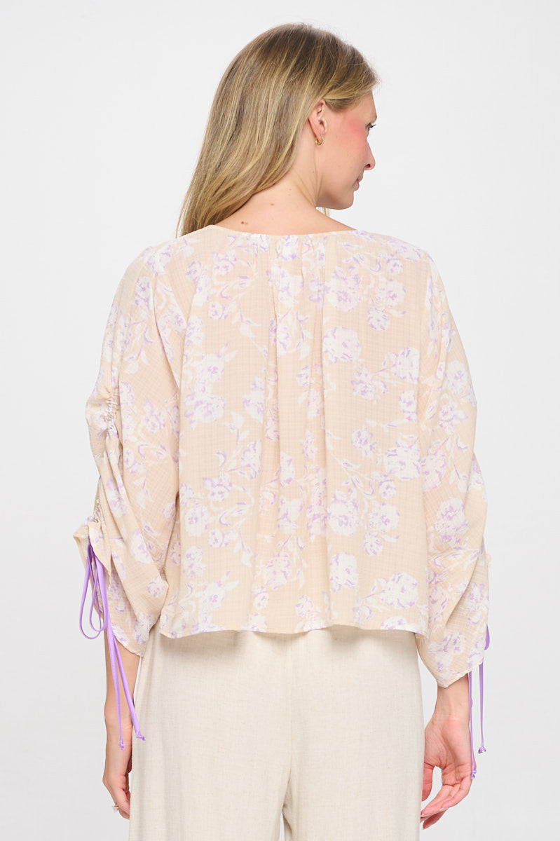 Close-up of floral print on Elegant Boat Neck Top by Reneecollection