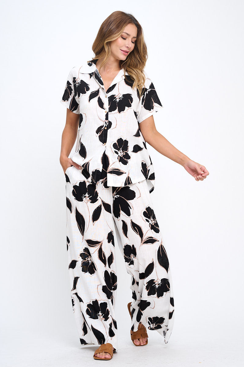 Model wearing Elegant Floral V-Neck Short Sleeve Top in casual setting by Reneecollection