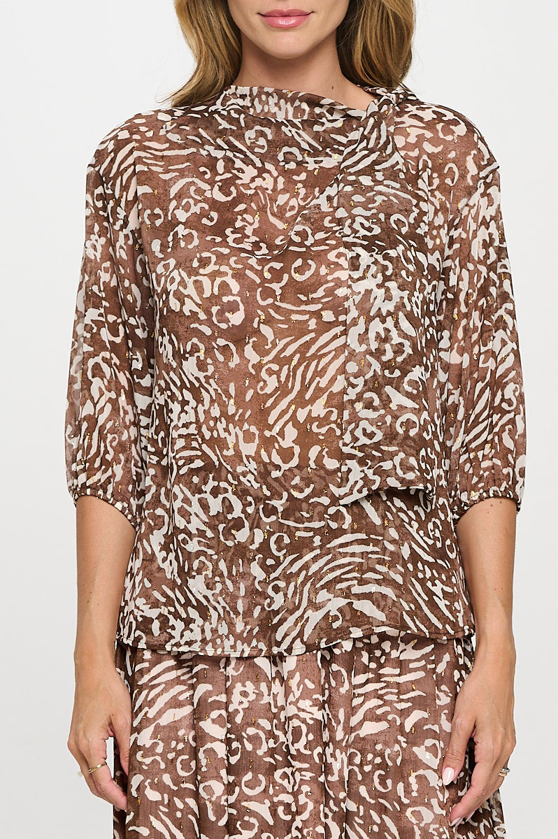 Close-up of abstract print on Elegant Sheer 3/4 Sleeve Top by Reneecollection
