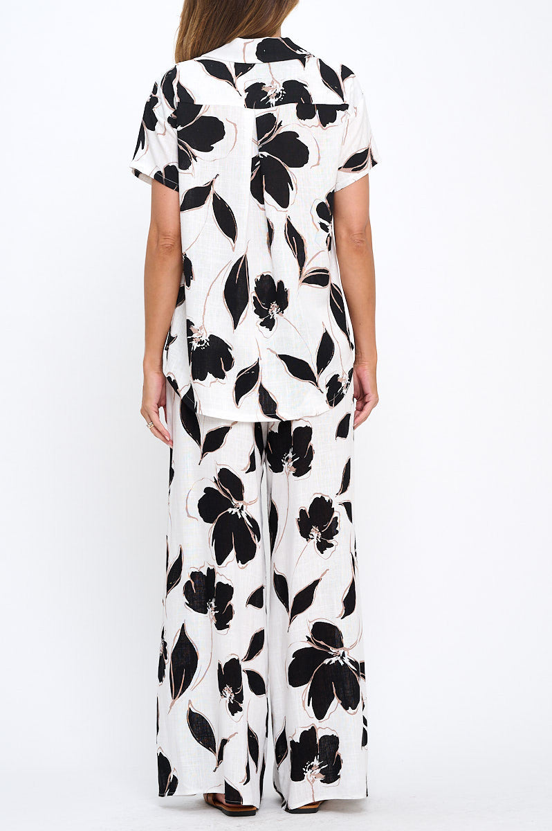 Close-up of fabric texture on Elegant Floral V-Neck Short Sleeve Top by Reneecollection