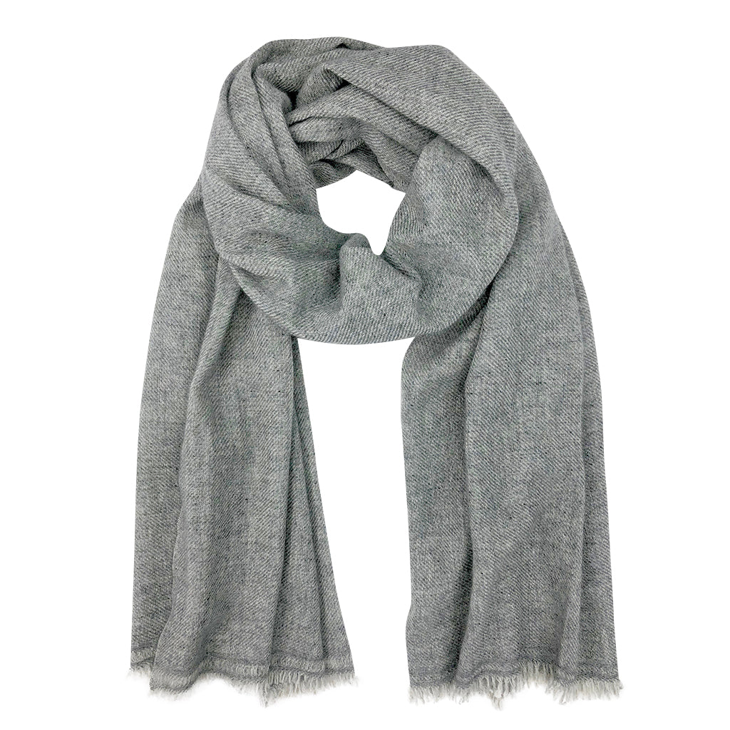 Elegant gray handloom cashmere scarf draped over a stylish outfit