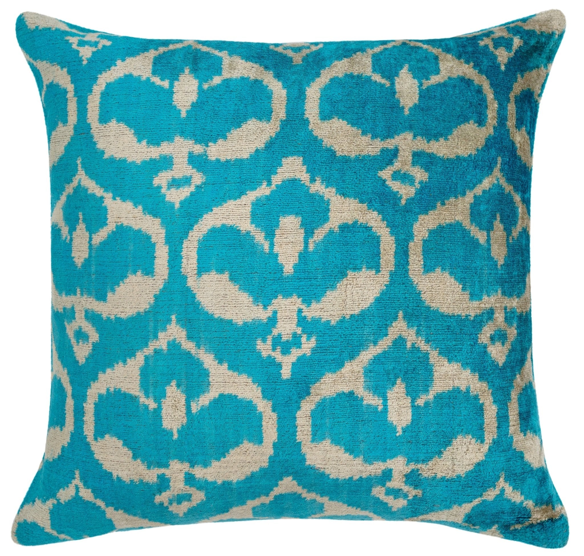 Close-up of the Ikat design on the turquoise velvet throw pillow by Canvello