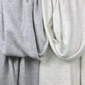 Elegant Gray Herringbone Cashmere Scarf draped on a chair