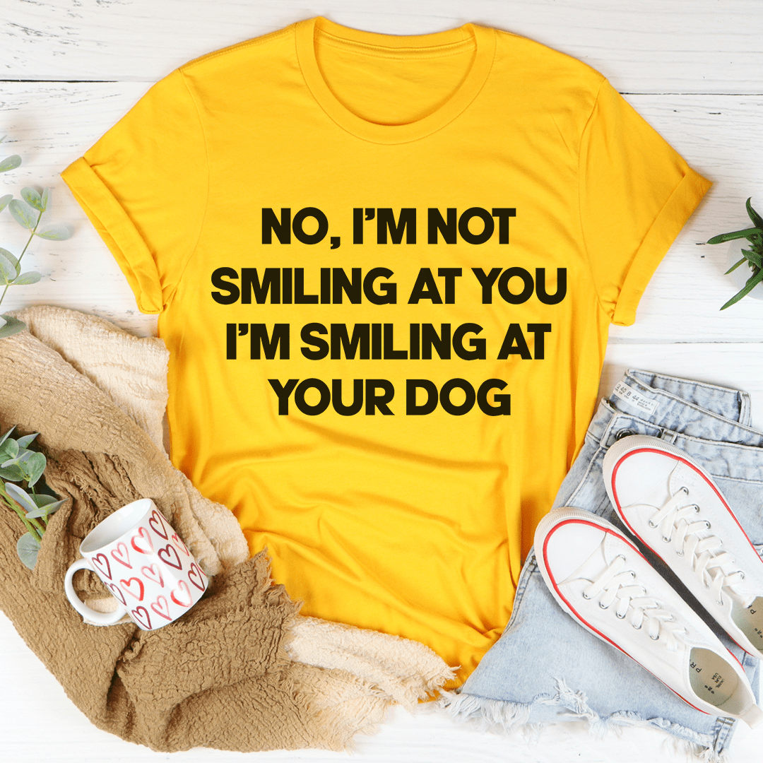Back view of I'm Smiling At Your Dog T-Shirt by MerchMallow