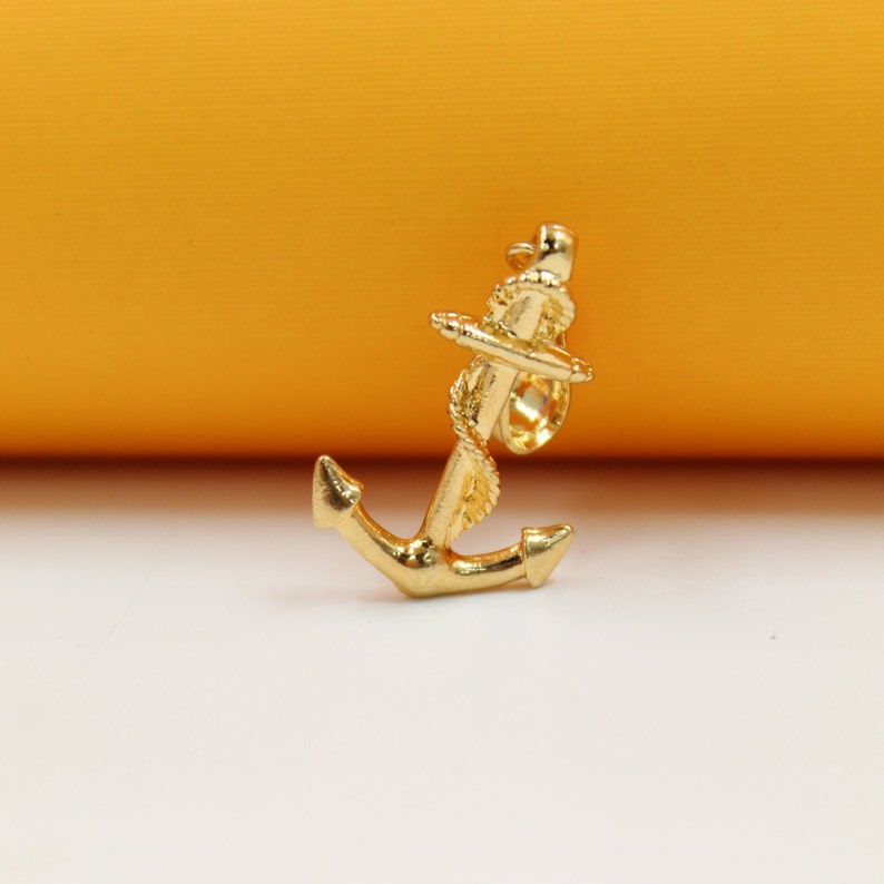 Elegant Nautical 18K Gold Filled Anchor Rope Pendant on display