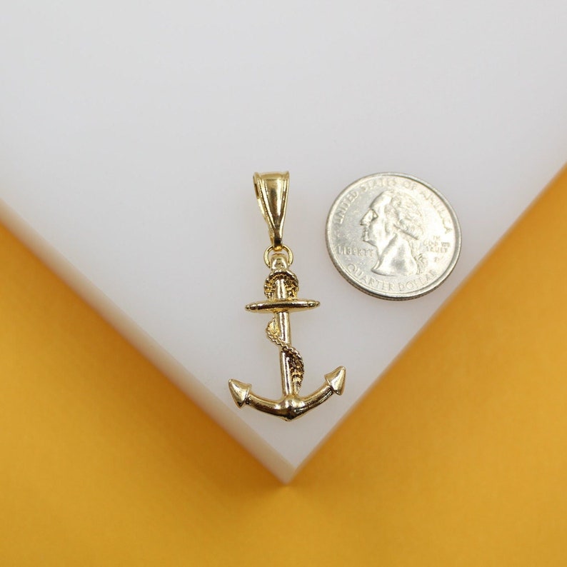 Lifestyle image of the 18K Gold Filled Anchor Rope Pendant worn with a casual outfit