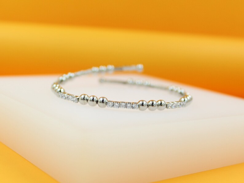 Adjustable 18K Rhodium Triple Bead Bracelet styled for casual wear