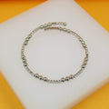 Elegant 18K Rhodium Triple Bead Bracelet by MIA Jewelry on display
