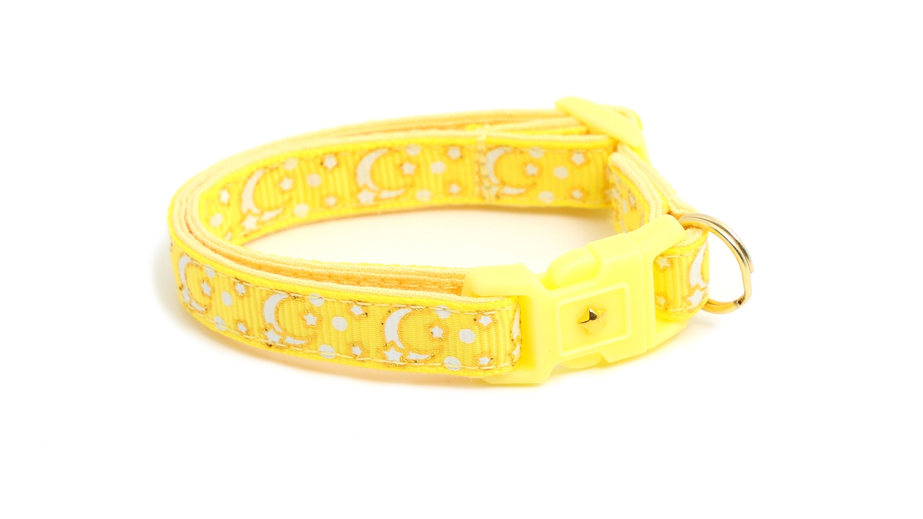 Front view of Illuminating Yellow Cat Collar with gold moons and stars