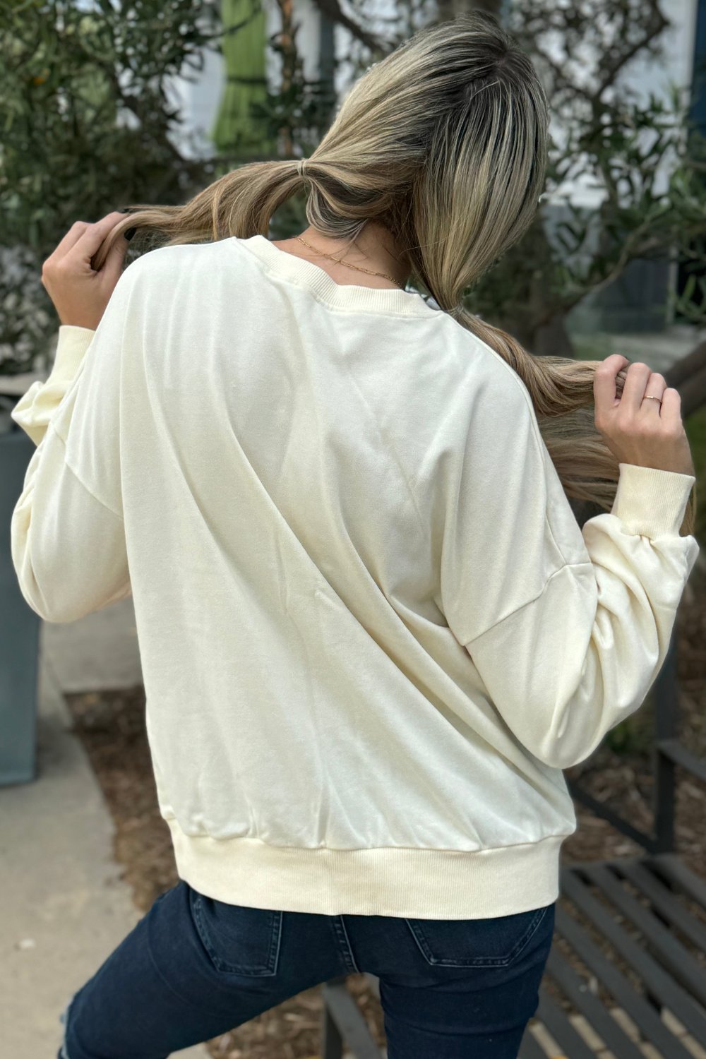 Close-up of the vibrant colors on Penelope Striped Pullover Sweatshirt by Threaded Pear