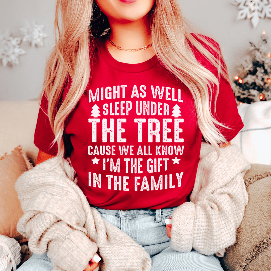 Model wearing Charming Christmas Tree Tee at a holiday party by MerchMallow