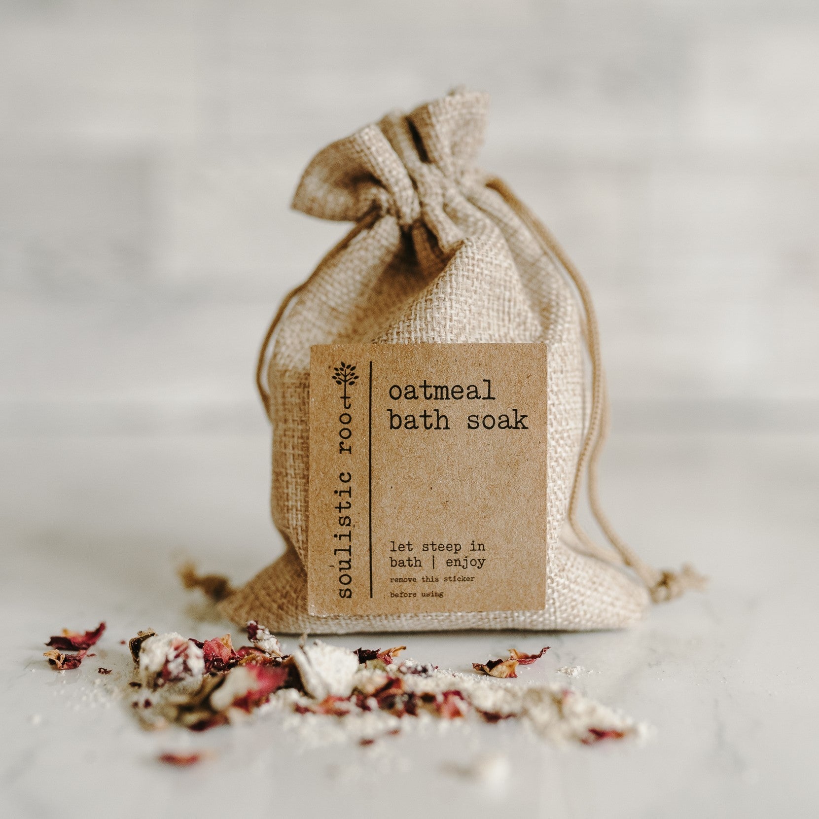 Relaxing bath setup with Herbal Oatmeal Bath Soak and herbs