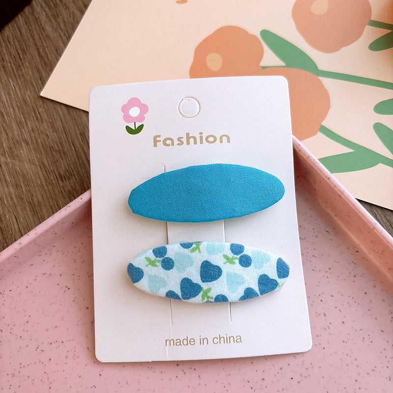 Of 2 Candy-Colored Oval Cloth Hair Clips