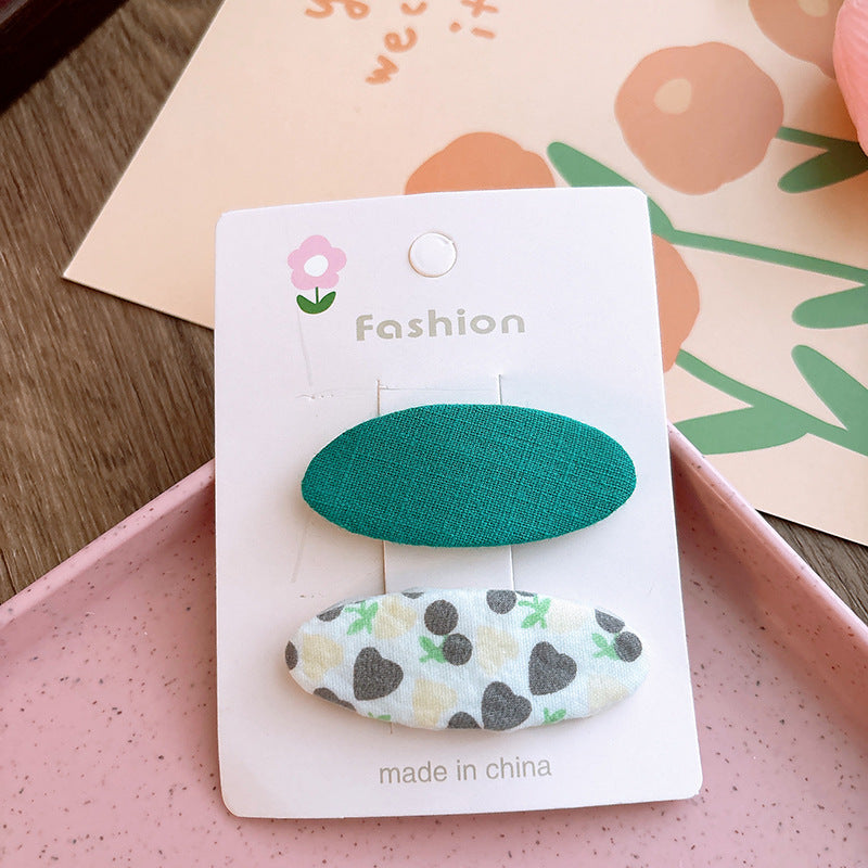Of 2 Candy-Colored Oval Cloth Hair Clips