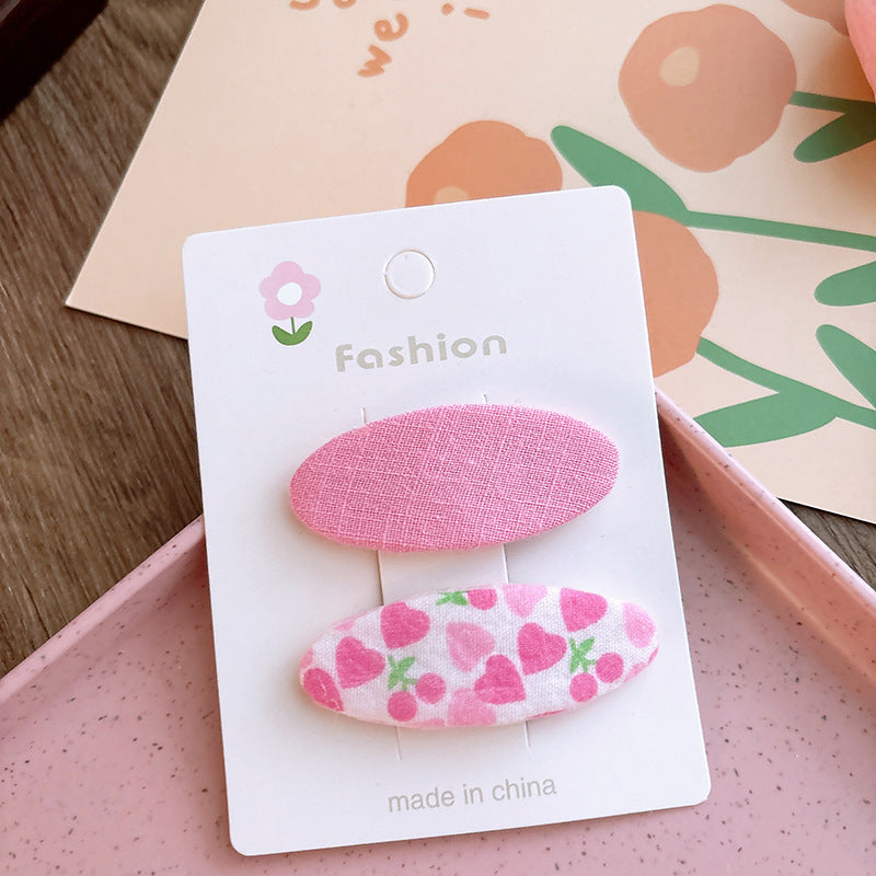 Of 2 Candy-Colored Oval Cloth Hair Clips
