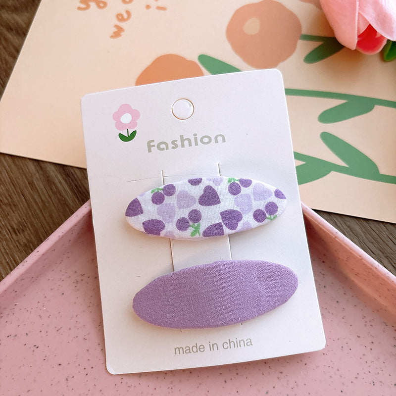 Of 2 Candy-Colored Oval Cloth Hair Clips