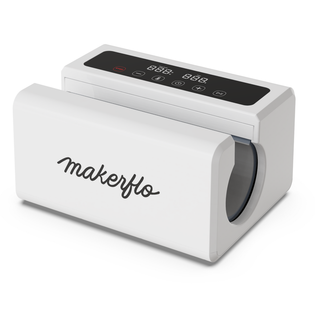 MakerFlo Automatic Tumbler Press in a creative crafting workspace