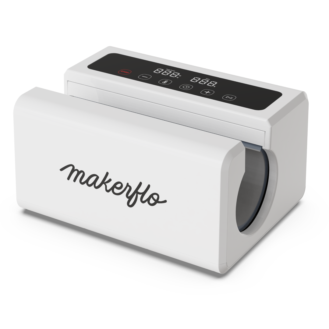 MakerFlo Automatic Tumbler Press in a creative crafting workspace