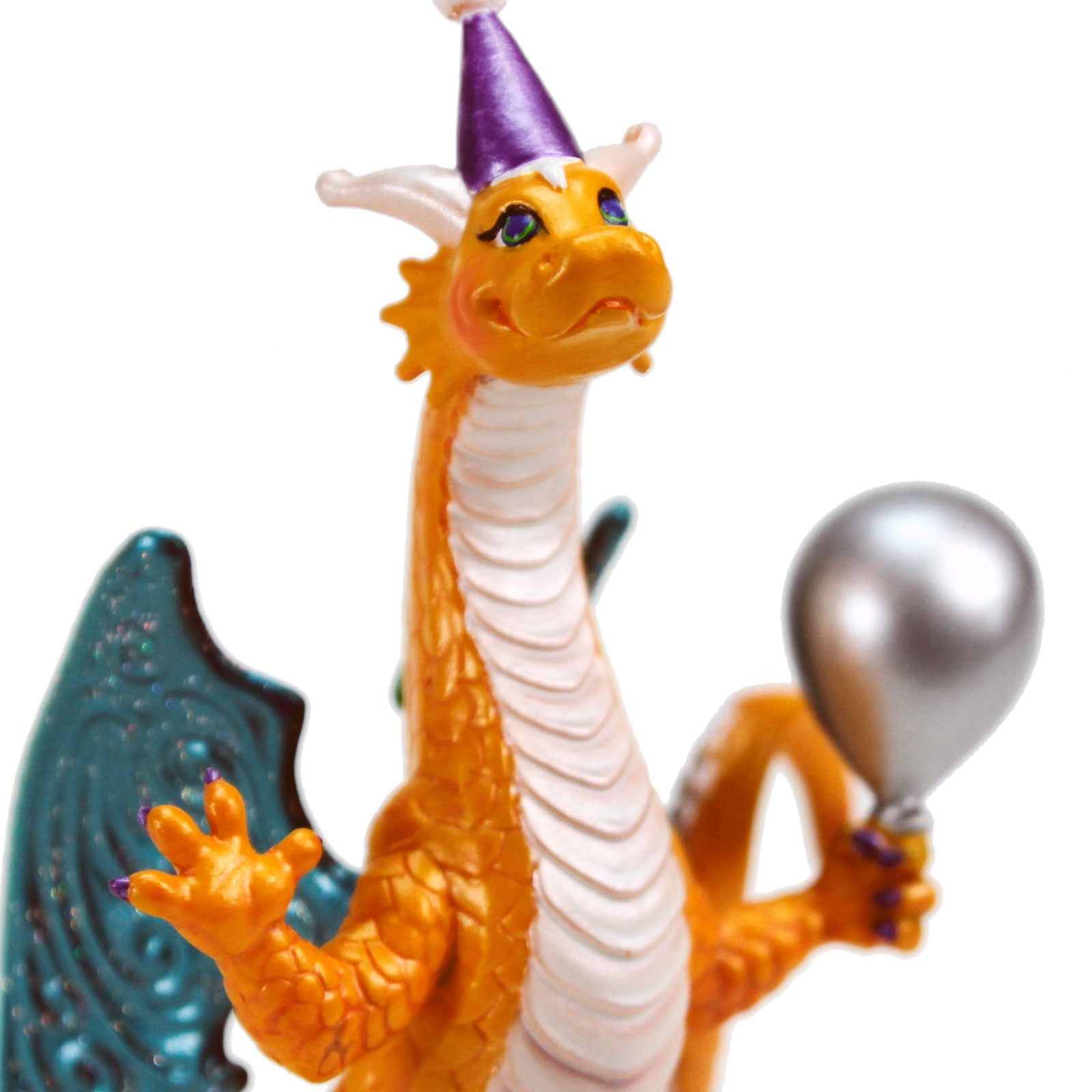 Side profile of Colorful Celebration Dragon Figurine showcasing vibrant colors